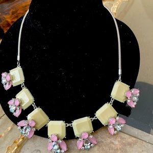 Necklace with pink and clear crystal bees.